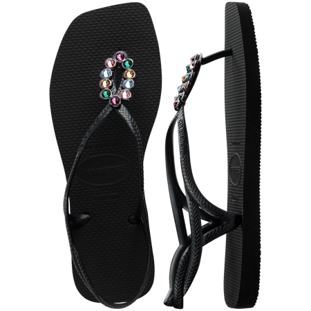 Women's black sandal featuring oval with multicolor crystal details top and side view