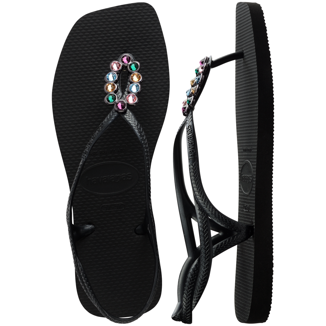 Women's black sandal featuring oval with multicolor crystal details top and side view