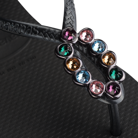 Women's black sandal featuring oval with multicolor crystal detail view