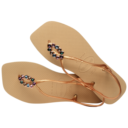 Women's tan sandal with oval multicolor crystal decoration and gold straps, alternate top view