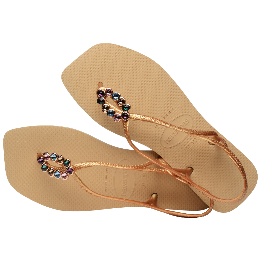 Women's tan sandal with oval multicolor crystal decoration and gold straps, alternate top view