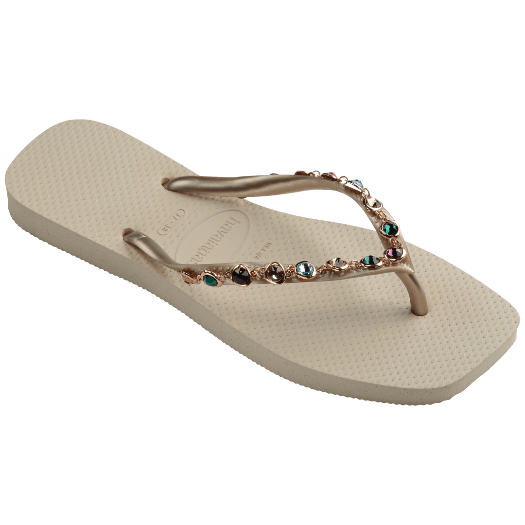 Women's square toe cream flip flops and gold straps with multicolor crystals, right 3/4 side view