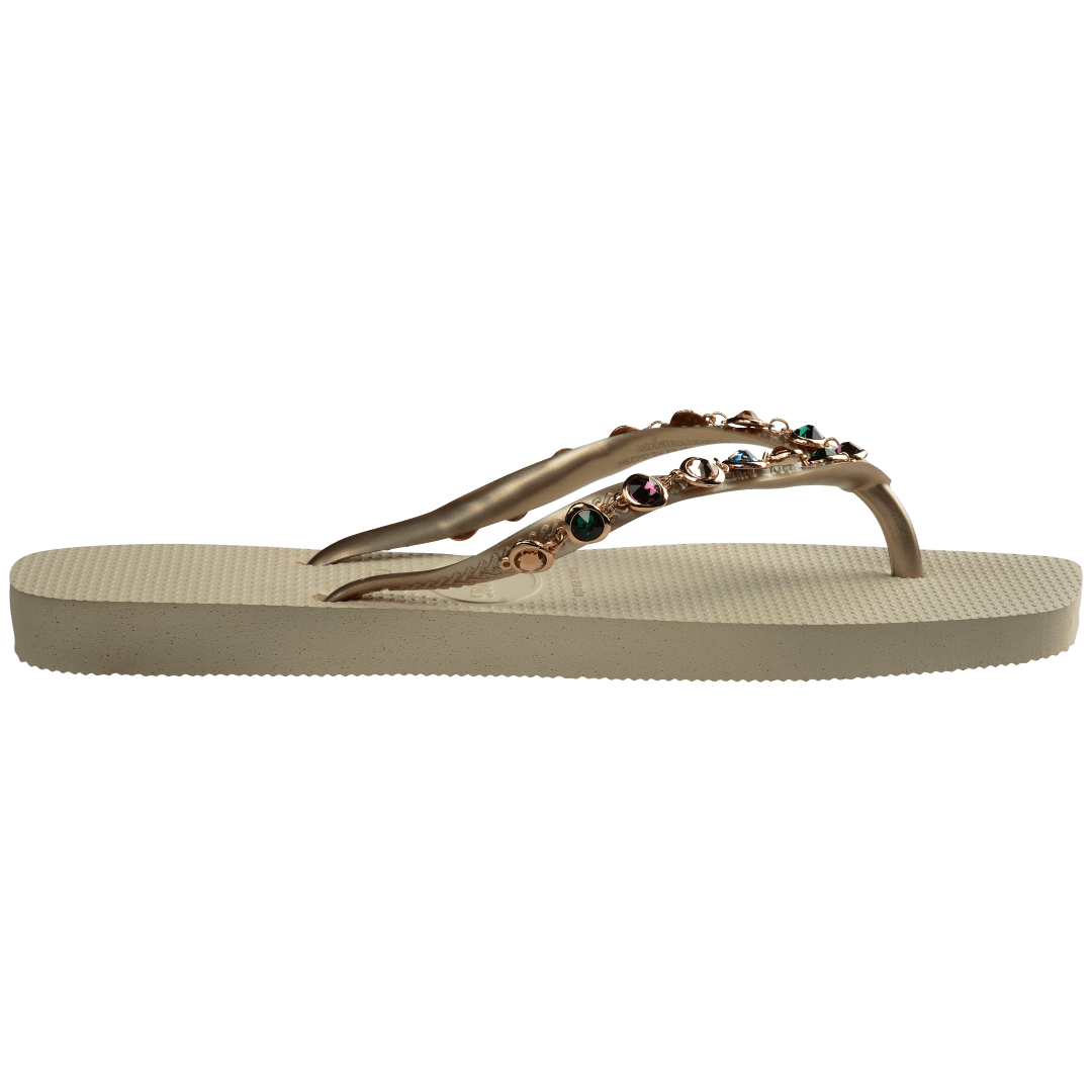 Women's square toe cream flip flops and gold straps with multicolor crystals, side view