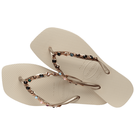 Women's square toe cream flip flops and gold straps with multicolor crystals, alternate top view