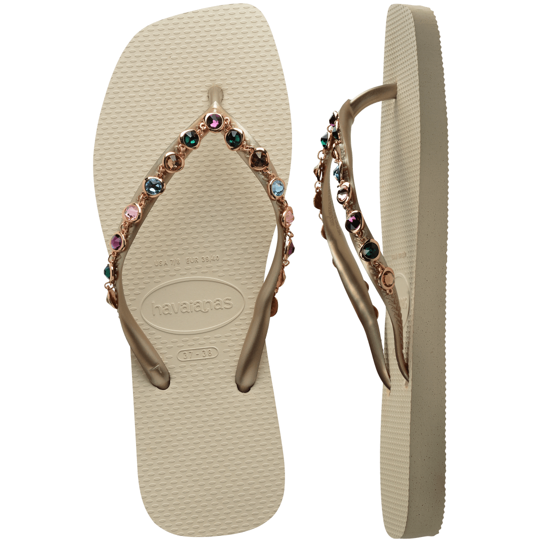 Women's square toe cream flip flops and gold straps with multicolor crystals, top and side view