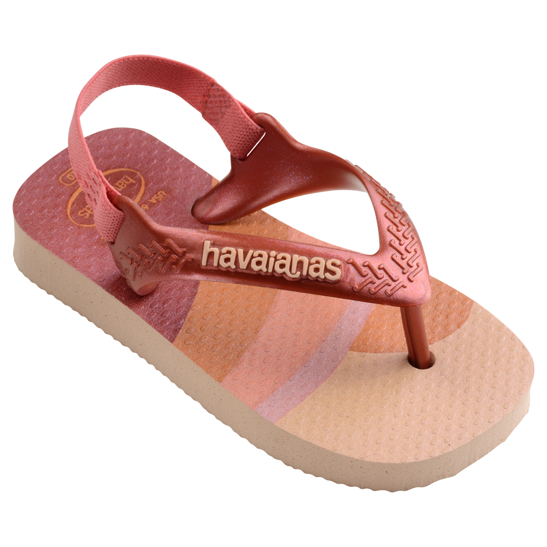 Baby flip flops with backstrap, abstract pink, beige and orange print with metallic pink straps, front right view