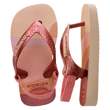 Baby flip flops with backstrap, abstract pink, beige and orange print with metallic pink straps, one top view and the other side view