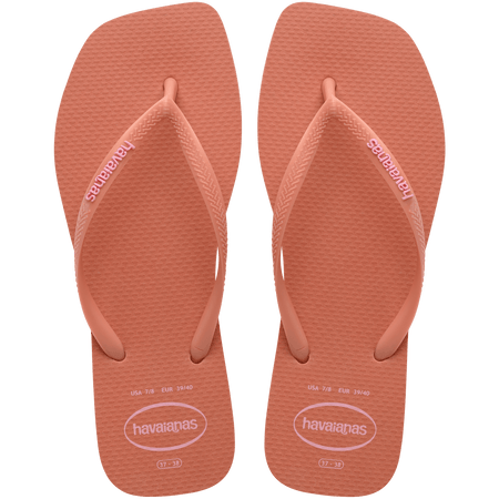 square-toe flip flop in orange color with pink havaianas logo on the strap, top facing