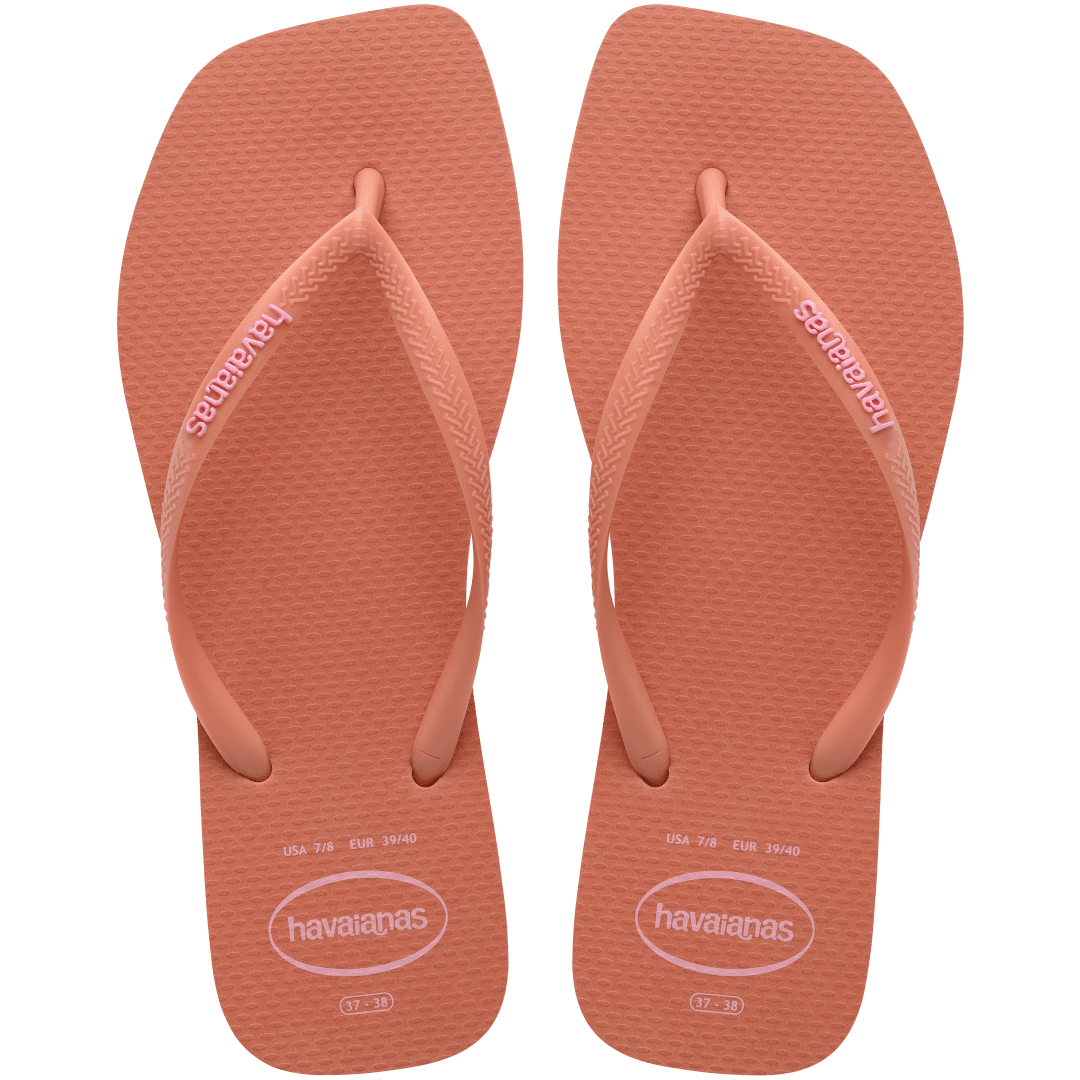 square-toe flip flop in orange color with pink havaianas logo on the strap, top facing