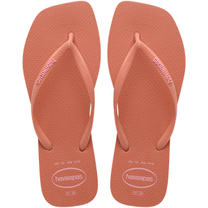 square-toe flip flop in orange color with pink havaianas logo on the strap, top facing