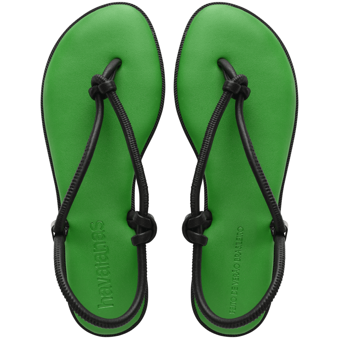 Women's green sole sandal with black straps top view