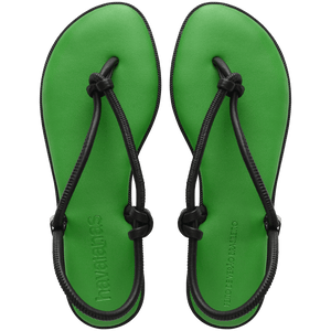 Women's green sole sandal with black straps top view