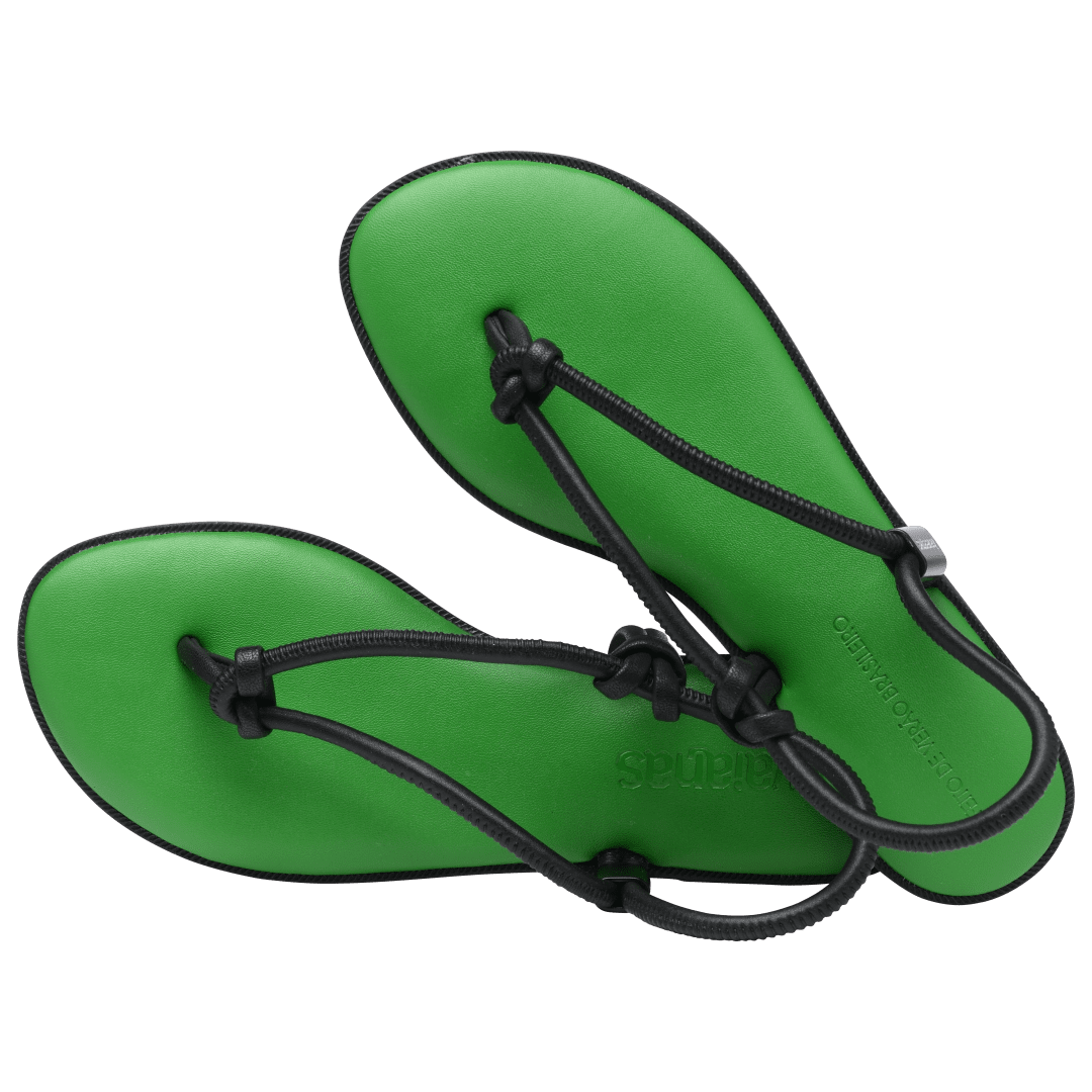 Women's green sole sandal with black straps alternate top view