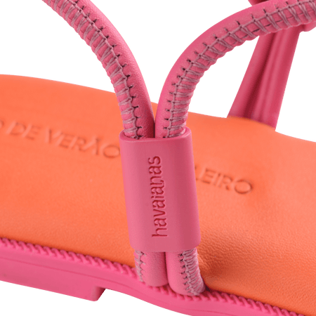 Women's orange sandal with contrast pink straps and sole logo detail view