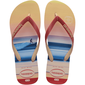 Multicolor flip flop with sunset horizon view over the ocean featuring a surfer top view