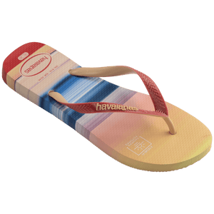 Multicolor flip flop with sunset horizon view over the ocean featuring a surfer right 3/4 view