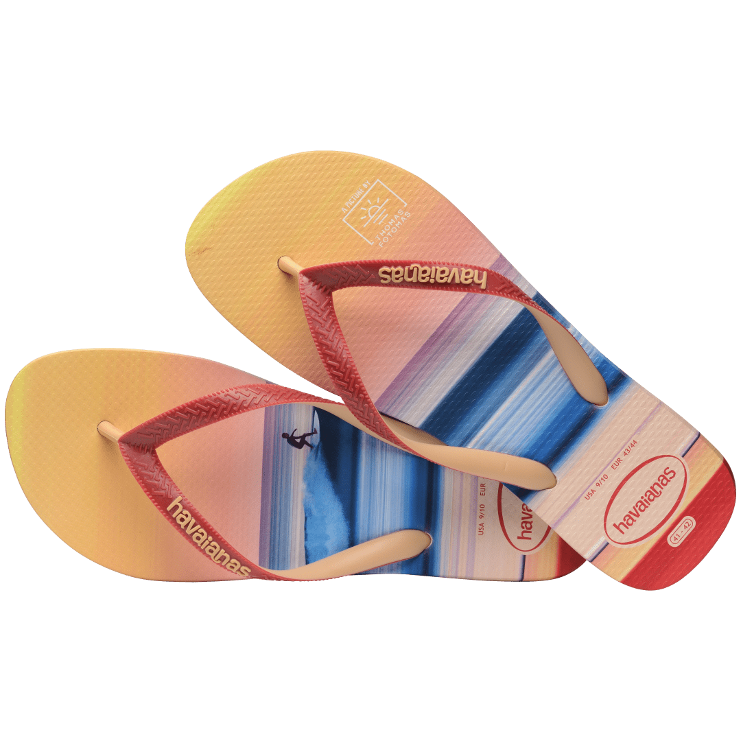 Multicolor flip flop with sunset horizon view over the ocean featuring a surfer top view alternate