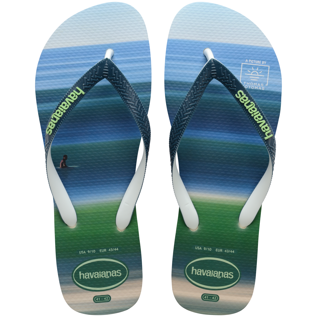 Men's green and blue surf print flip flops top view