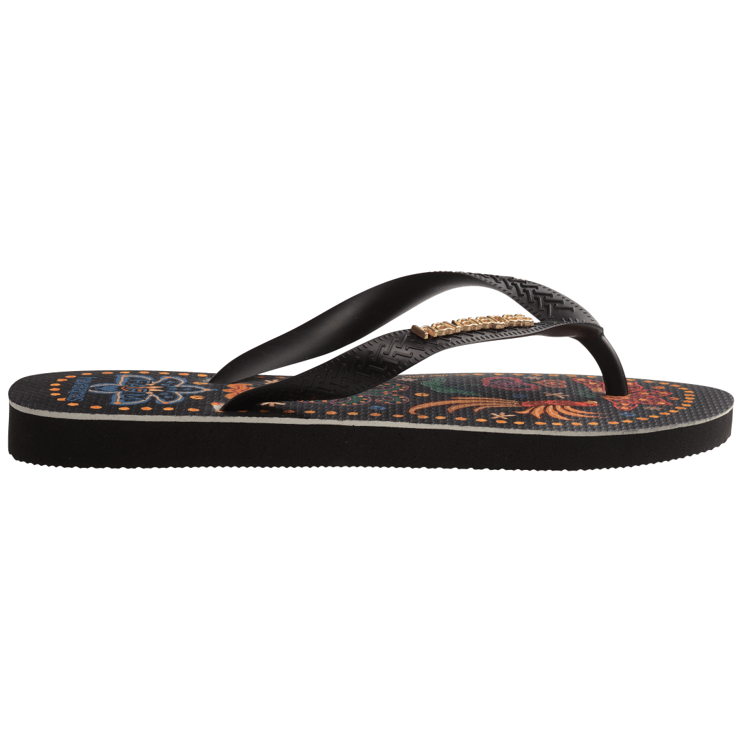 Women's FARM Rio x Havaianas tropical print with flowers, pineapples and old dots around the edge of the sole, side view