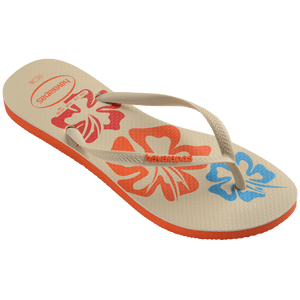 Women's cream flip flop with blue, orange and red flowers and orange printed Hawaii on the left foot 3/4 side view showing orange sole