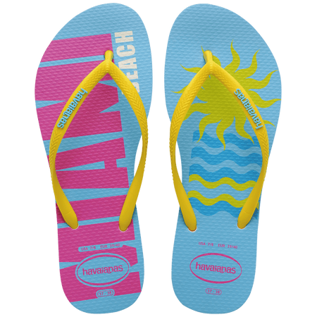 Women's light blue flip flops with yellow straps and pink Miami print on the left foot and yellow sun and blue waves print on the right foot top view