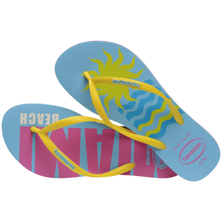 Women's light blue flip flops with yellow straps and pink Miami print on the left foot and yellow sun and blue waves print on the right foot alternate top view