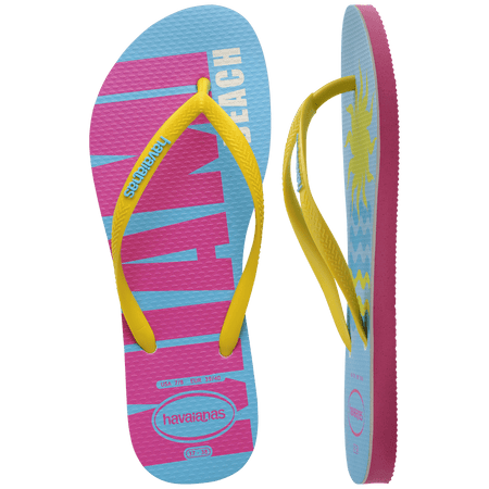 Women's light blue flip flops with yellow straps and pink Miami print on the left foot and yellow sun and blue waves print on the right foot top and side view showing pink sole