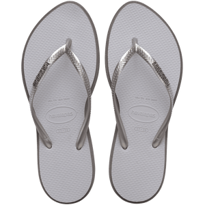 light grey sandals with darker grey outline around footbed, with metallic grey straps and a silver metal havaianas logo on the strap, top view