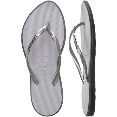 light grey sandals with darker grey outline around footbed, with metallic grey straps and a silver metal havaianas logo on the strap, one shoe top view one shoe side view