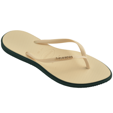 Women's cream pointed toe flip flops with dark green contrast sole 3/4 side view