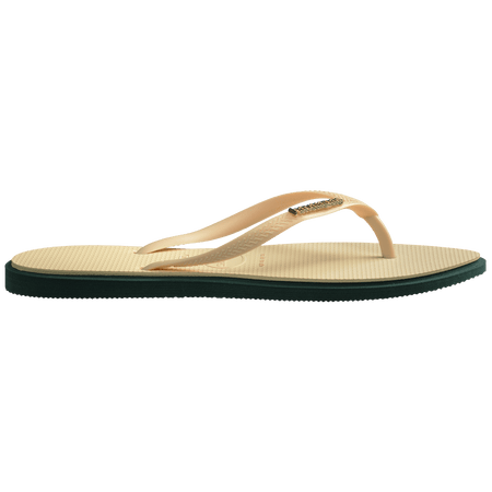 Women's cream pointed toe flip flops with dark green contrast sole side view