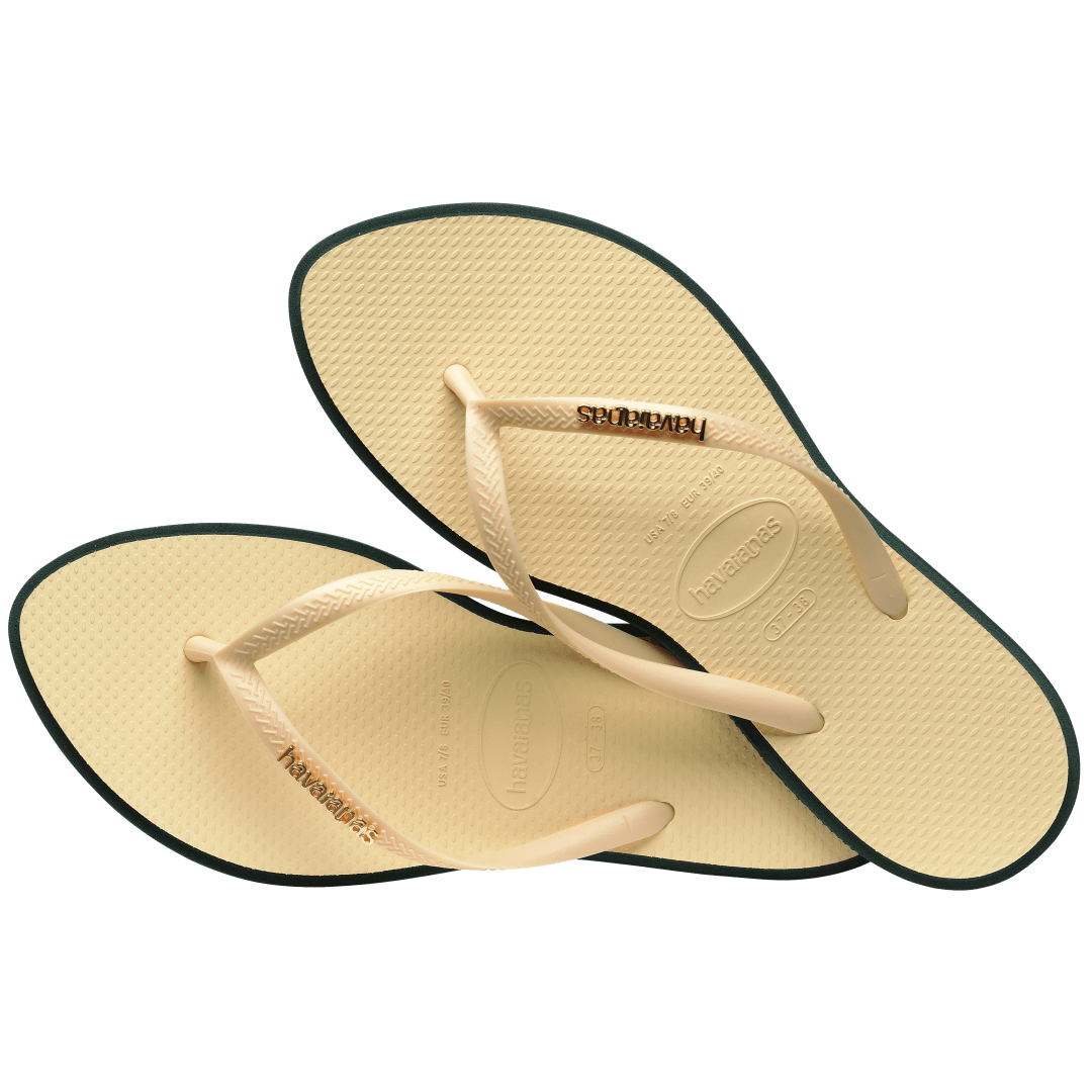 Women's cream pointed toe flip flops with dark green contrast sole alternate top view