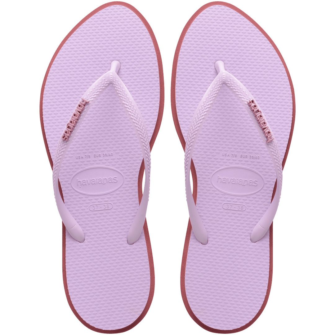 Women's light purple pointed toe flip flops with red contrast sole, top view