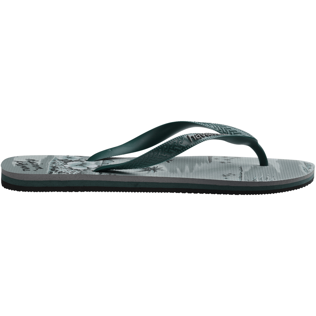 Maison Kitsune x Havaianas teal tonal tropical print flip flops with dark green straps, side view