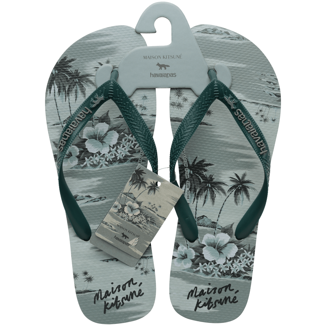 Maison Kitsune x Havaianas teal tonal tropical print flip flops with dark green straps, top view with packaging