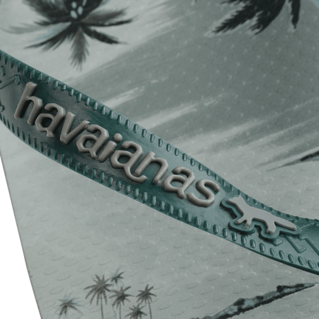 Maison Kitsune x Havaianas teal tonal tropical print flip flops with dark green straps, detail view