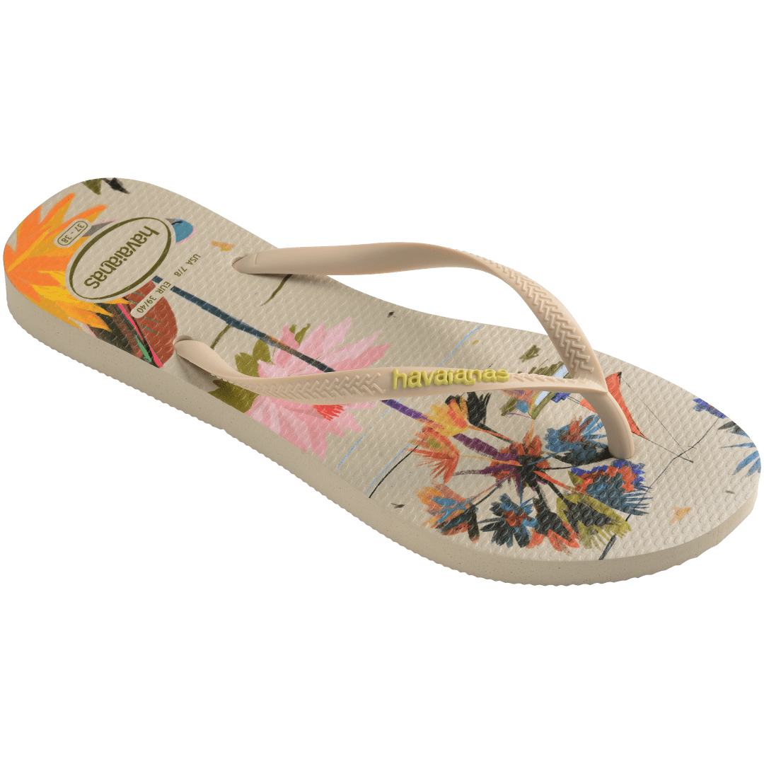 Women's boat, beach umbrella and floral print multi colored flip flop top side angle view