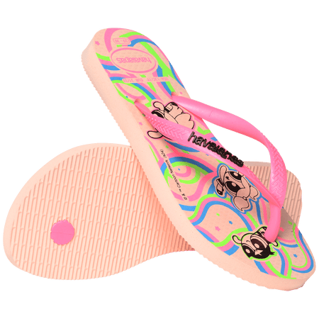 Powerpuff Girls flying on a neon green, blue, and pink background sole of flip flops, with pink straps with black Havaianas logo, one flip flop leaning on the other flip flop, toe side down