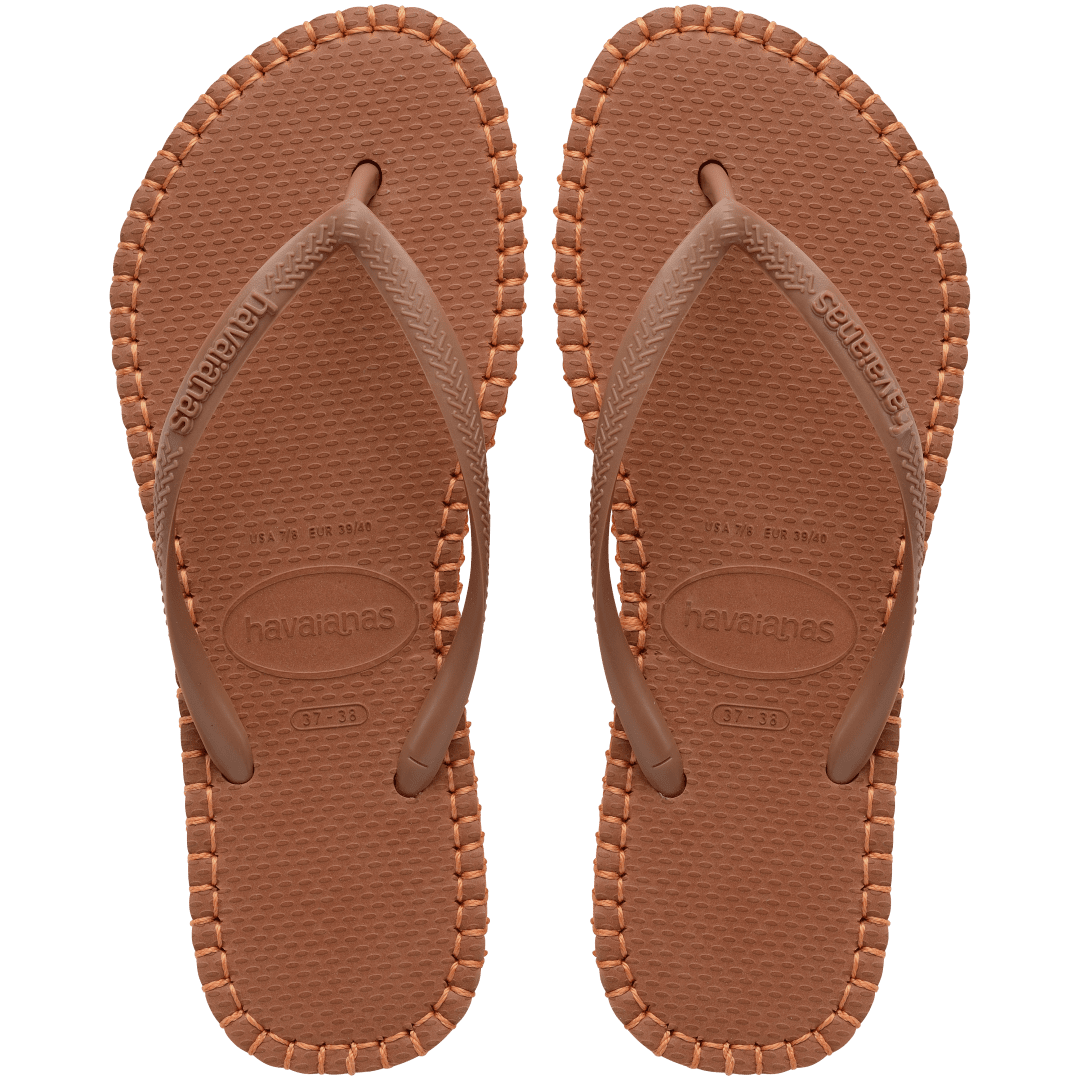 brown flip flops with orange stitching around the sole, and orange midlayer between the sole and bottom of shoe, top view