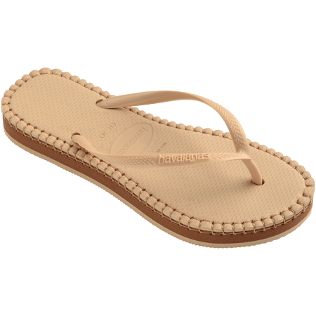 beige sandal with darker brown stitching and a dark brown midlayer between the sole and bottom of shoe, front right view