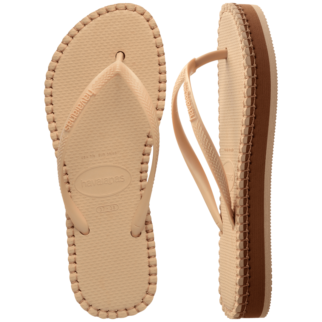 beige sandal with darker brown stitching and a dark brown midlayer between the sole and bottom of shoe, one sandal top view, one sandal side view