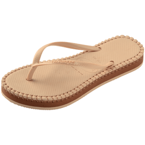 beige sandal with darker brown stitching and a dark brown midlayer between the sole and bottom of shoe, front left view