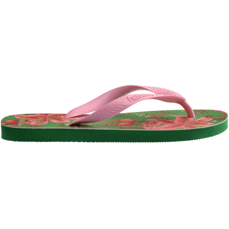 flip flops with green sole featuring pink flowers and pink straps, side facing