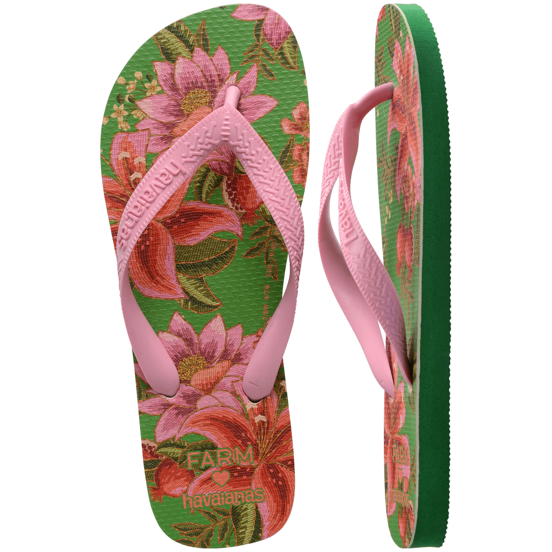 flip flops with green sole featuring pink flowers and pink straps, one top facing and one side facing