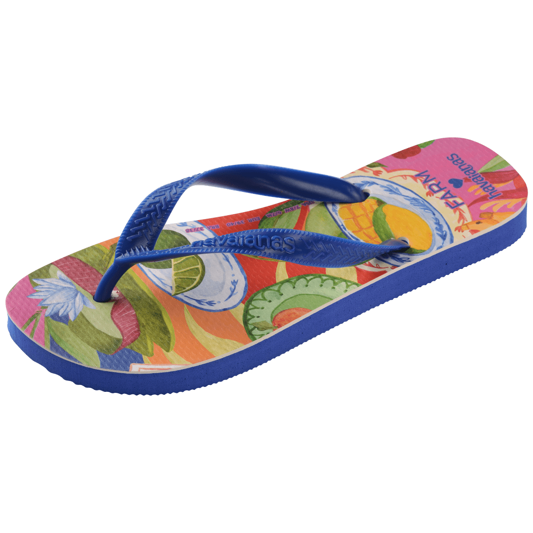 flip flops with fruit on a multicolor background with blue straps, front-diagonal facing