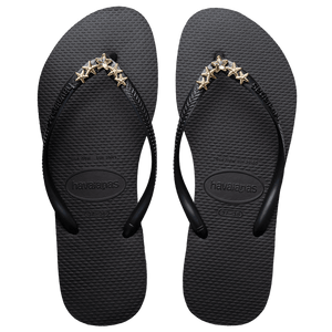 Women's black flip flops with gold star charm embellishment, top view