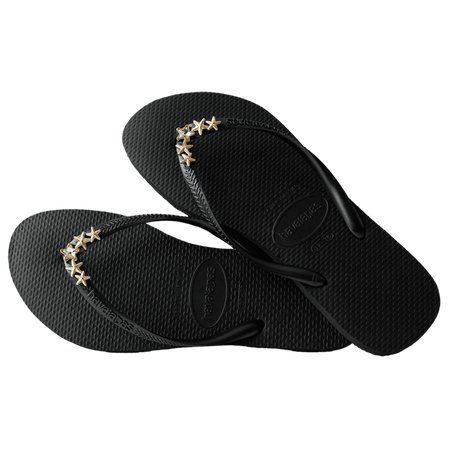 Women's black flip flops with gold star charm embellishment, alternate top view